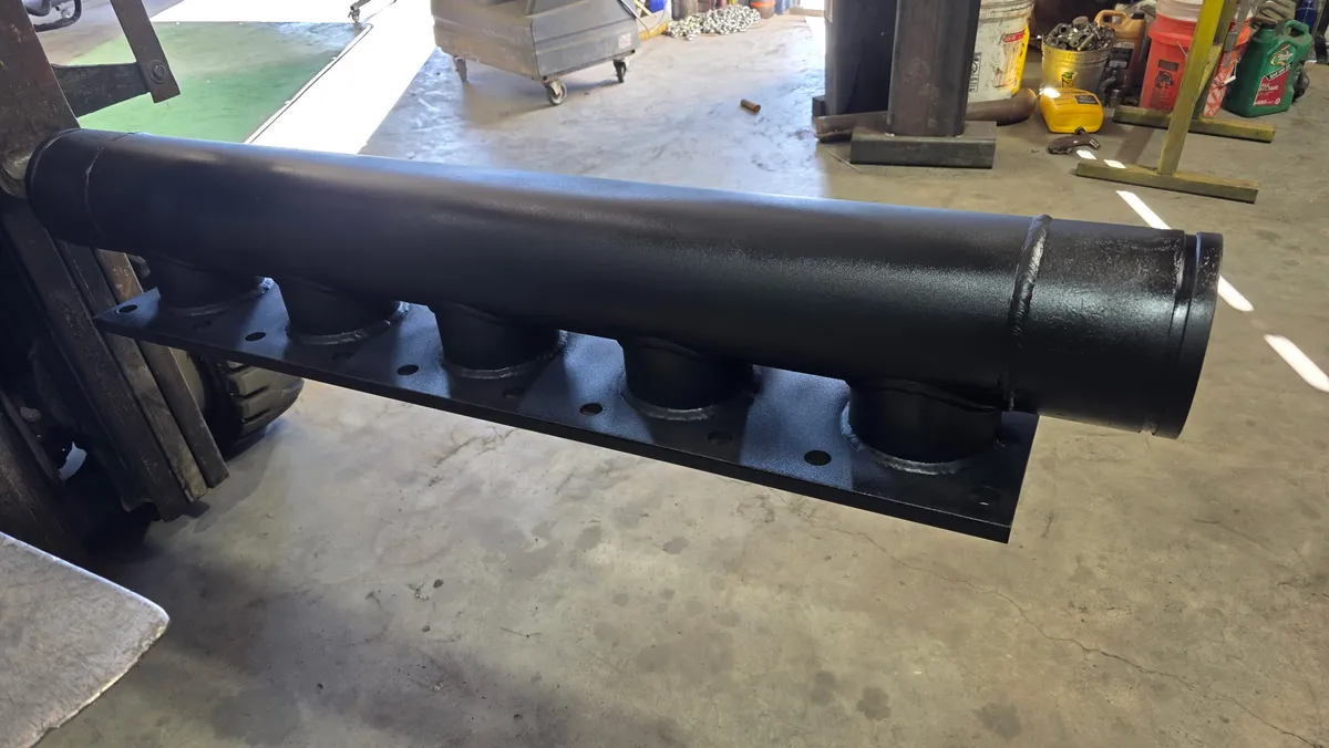 Custom-fabricated steel header